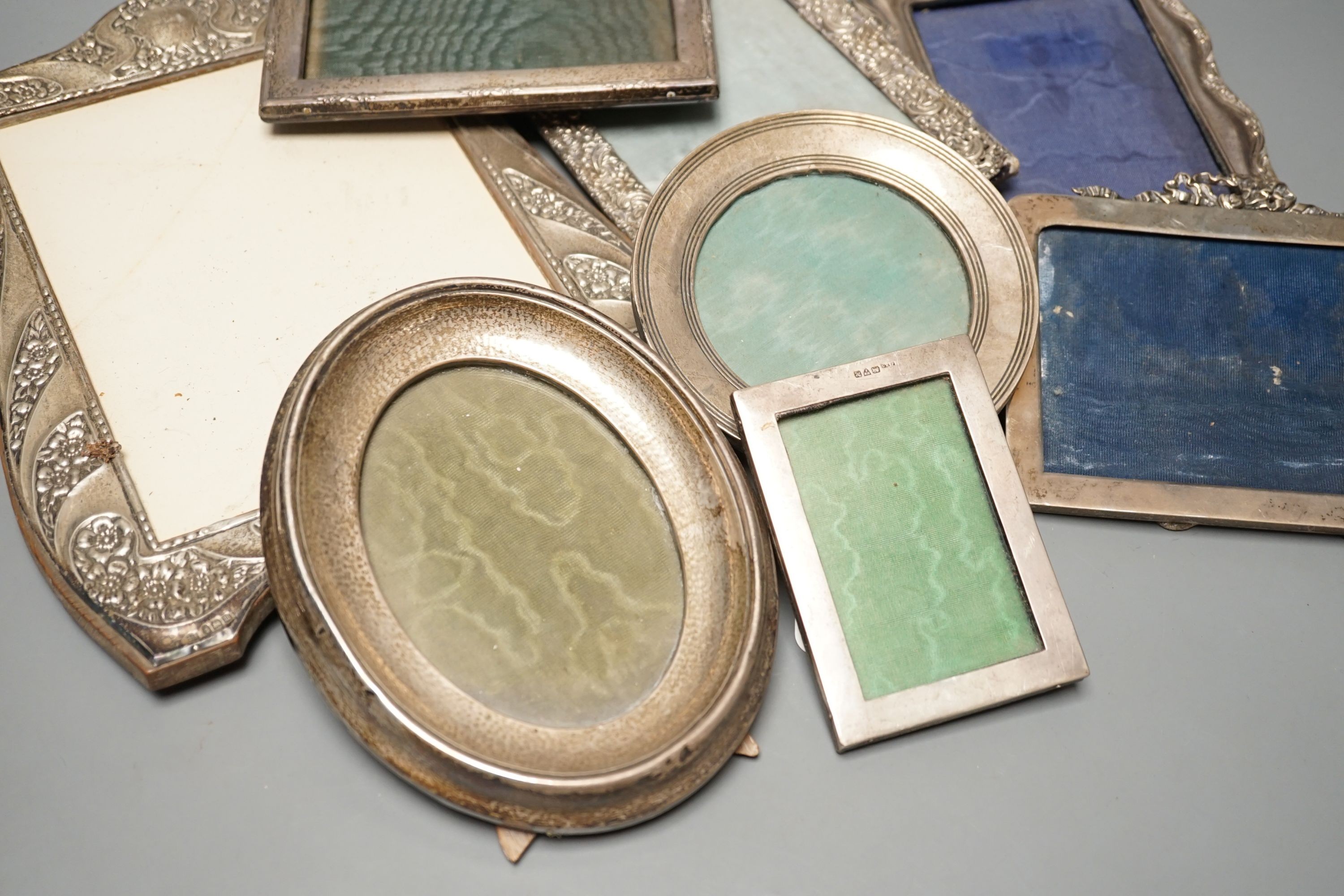 A mixed group of eight various small silver mounted photograph frames, largest 29cm and dated for Birmingham, 1911.